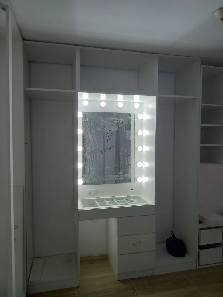 Custom closet with built-in shelving and drawers by KBTony